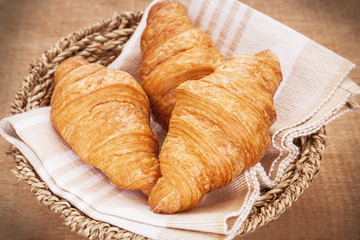 Croissants in basket, filtered image