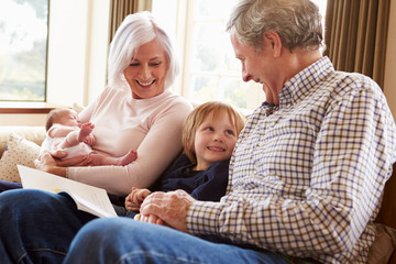 Obraz premium Grandparents With Grandson And Newborn Baby Granddaughter