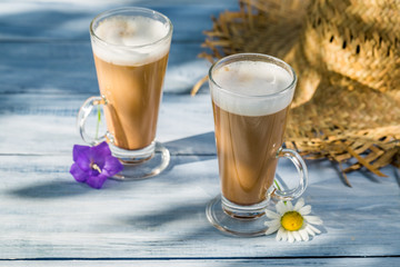 Coffee latte served in a sunny day