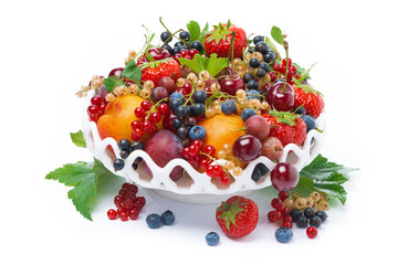 dish with seasonal fruit and berries, isolated