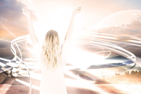 Composite image of pretty football fan in white cheering