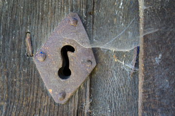 Old lock and spiderweb