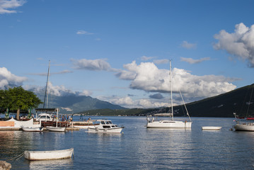 Fototapeta na wymiar Boats tied up in a bay by the coast