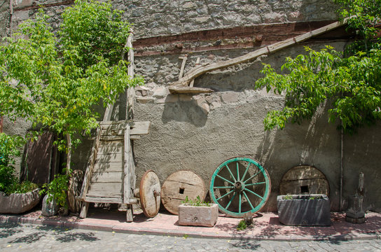 Old wood plow, tumbrel and wheels