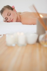 Obraz na płótnie Canvas Beautiful blonde relaxing on massage table