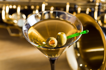 saxophone and martini with green olives