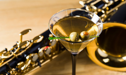 saxophone and martini with green olives