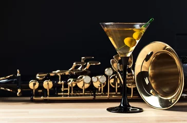 Zelfklevend Fotobehang saxophone and martini with green olives © Igor Normann