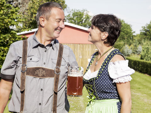 Man and woman with beer mug in Bavaria