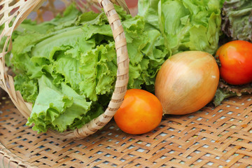 Vegetables salad and tomato in the basket