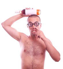 Drunk nerd in eyeglasses picking his nose