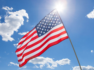 USA flag waving on blue sky background