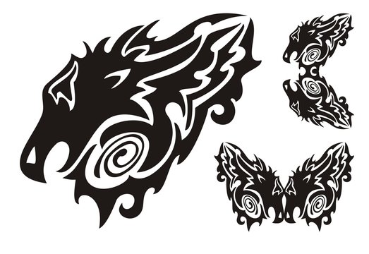 Tribal dragon head and twirled dragons symbols