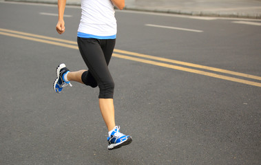 Fototapeta premium Runner athlete running on city road. 
