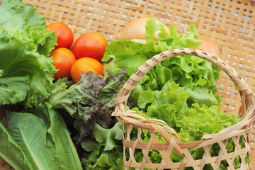 Vegetables salad and tomato in the basket