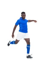 Fototapeta na wymiar Football player in blue kicking