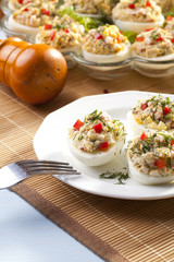 stuffed eggs with ham, red pepper and dill