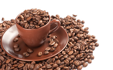 Coffee cup and beans on a white background