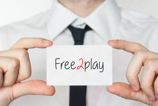 Free2play. Businessman holding business card