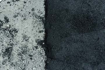Hot fresh and old asphalt layers on road surface