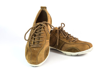 brown suede sports shoes on white background