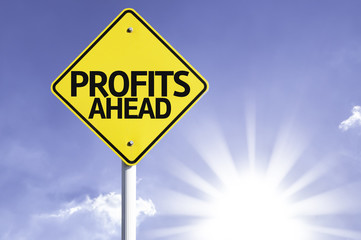 Profits Ahead road sign with sun background