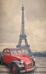 Eiffel Tower and red car with retro vintage style filter effect.