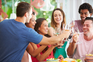 Group Of Friends Enjoying Drinks Party At Home