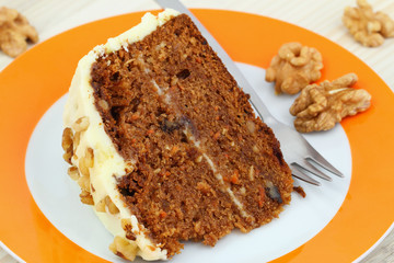 Carrot cake with walnuts and marzipan icing, close up