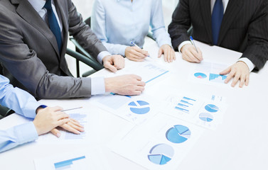 close up of chats and graphs in office