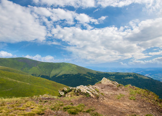 Stones on a hillside with beautiful sky.