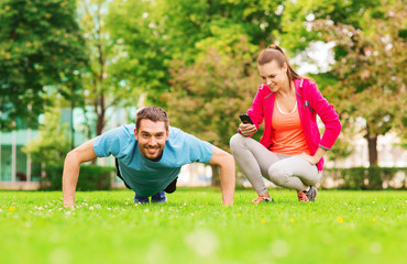 smiling man doing exercise outdoors