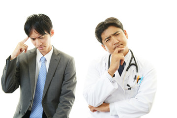 頭痛を訴えるビジネスマン