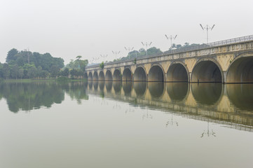 Under bridge and reflection with morning mist