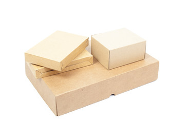 Small brown cardboard boxes stacked on top large box.