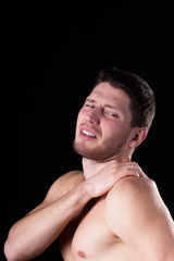 Man with strong shoulder pain