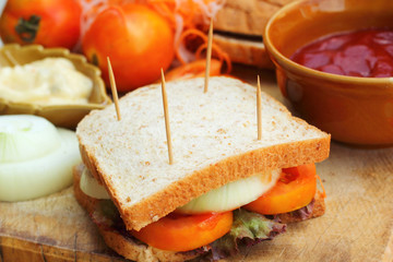 making tuna sandwich with fresh vegetables