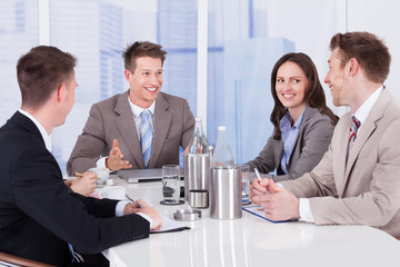 Business People Discussing At Conference Table