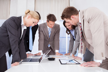 Business People Working At Conference Table