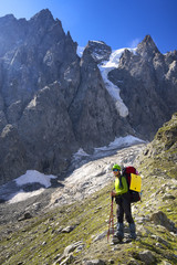 Fototapeta premium Tourist in the rocky valley. Sport and active life concept