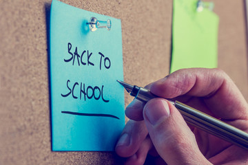 Man writing a memo - Back to School