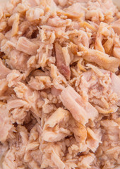 Flaked tuna pieces close up view