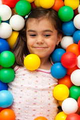 Fototapeta na wymiar girl in toy balls