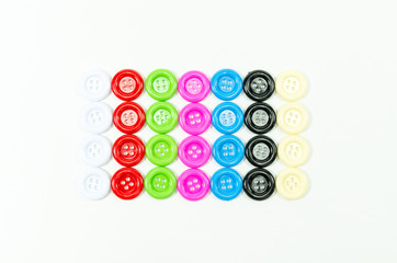 colorful of buttons sewing on white background