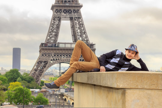 Young man hipster on the background of the Eiffel tower, France