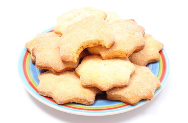 Fresh homemade cookies on colorful plate. White background