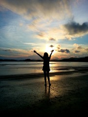 Fototapeta premium Woman hand up on the beach