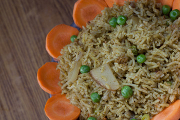 A healthy tomato  biriyani with a salad of carrot