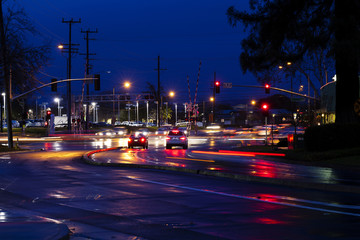Fototapeta na wymiar Suburban Interscetion Streets Cars Stop Lights Night
