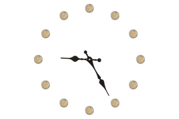 Clock made out of euro coins isolated on a white background